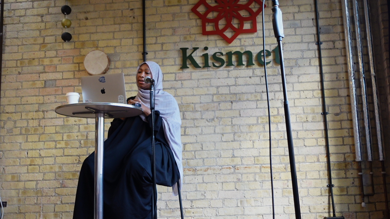 Ameenah delivering a talk at Kismet